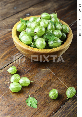 gooseberries in a plate on a wooden background gooseberries in a plate on a wooden background 64220534