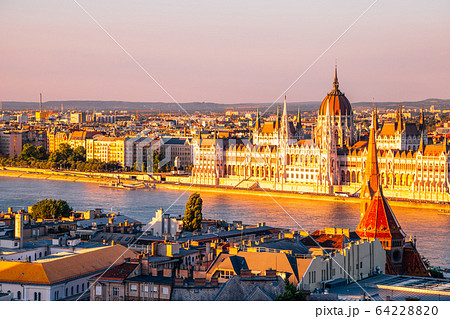 Hungarian Parliament Building with Danube river at sunset in Budapest, Hungary Hungarian Parliament Building with Danube river at sunset in Budapest, Hungary 64228820