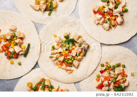 Stewed chicken with vegetables corn pepper tomato Stewed chicken with vegetables corn pepper tomato 64231092