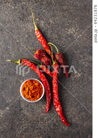 Dried red chili peppers and chili powder 64231876