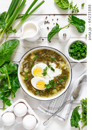 Green sorrel and spinach soup with boiled egg and Green sorrel and spinach soup with boiled egg and 64235886