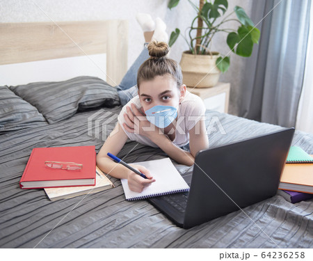 Schoolgirl studing at home 64236258