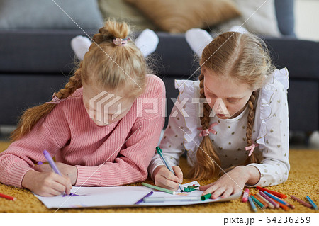 Children drawing a picture 64236259