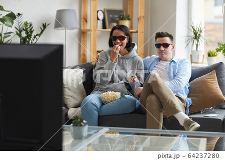 Couple watching the film 64237280