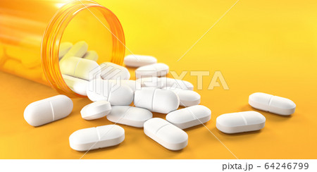 Pills and orange pill bottle on yellow background 64246799