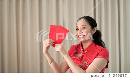 Asian woman happy face chinese new year festival red traditional costume Asian woman happy face chinese new year festival red traditional costume 64246837