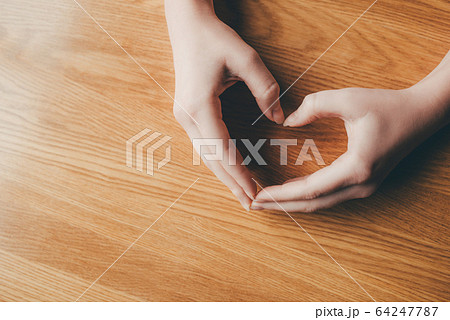 Female hands in the form of heart. Female hands in the form of heart. 64247787