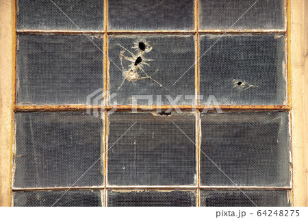 Old destroyed abandoned yellow house with the 64248275