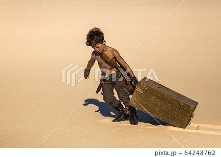 Post-apocalyptic Warrior Boy Outdoors in Desert Wasteland 64248762
