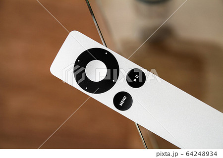 The modern grey steel Remote Control lies on a The modern grey steel Remote Control lies on a 64248934
