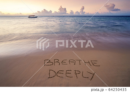 handwritten Breathe deeply on sandy beach handwritten Breathe deeply on sandy beach 64250435