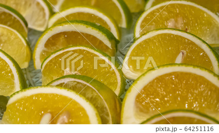 The close up of fresh citrus sinensis fruit (sweet orange) on glass plate. The close up of fresh citrus sinensis fruit (sweet orange) on glass plate. 64251116
