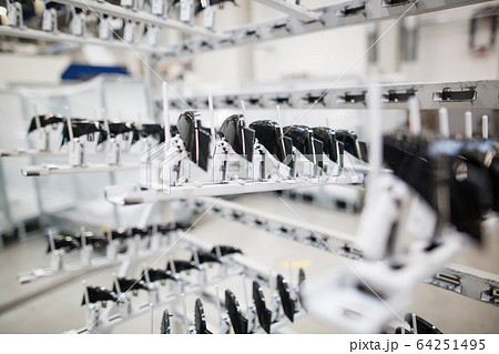Freshly molded plastic moldings in automotive smart factory, industrial concept 64251495