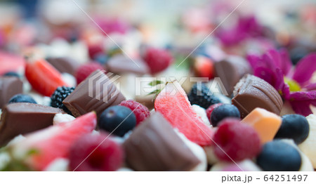 Close up of fruity chocolate cake with kind of fresh fruit and chocolate, food concept 64251497