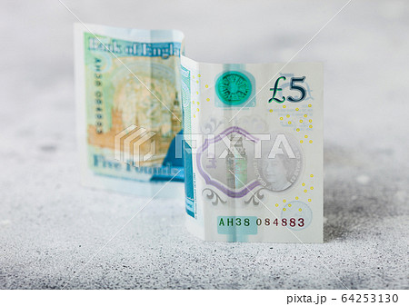 Five pounds banknote on light background. Economy Five pounds banknote on light background. Economy 64253130