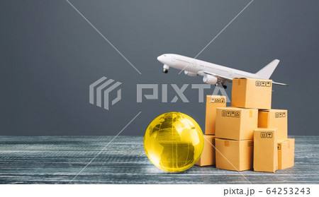 Boxes with globe and freight plane. International delivery of goods and products. Logistics, infrastructure hubs. Global business, import, export. Economic relations commerce. Cargo air transportation Boxes with globe and freight plane. International delivery of goods and products. Logistics, infrastructure hubs. Global business, import, export. Economic relations commerce. Cargo air transportation 64253243