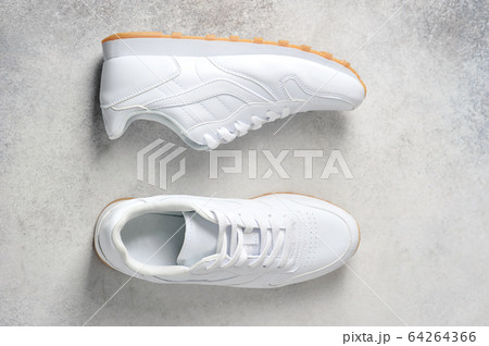 pair of white athletic sneakers 64264366