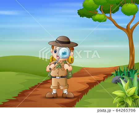 The explorer boy with magnifying glass on the road The explorer boy with magnifying glass on the road 64265706