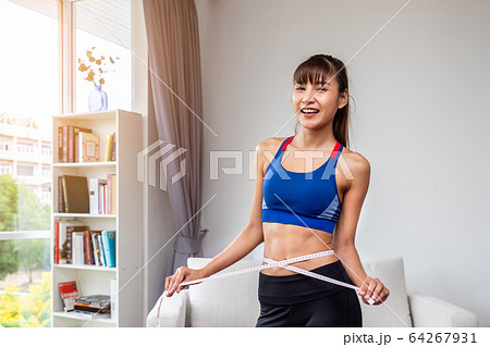 Attractive female woman torso with measuring tape, Attractive female woman torso with measuring tape, 64267931