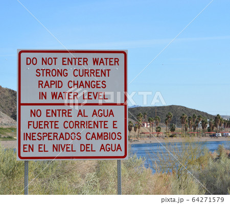 Rapid Changes in Water Level and Do Not Enter the Water sign overlooking the Colorado River in Laughlin, Clark County, Nevada USA Rapid Changes in Water Level and Do Not Enter the Water sign overlooking the Colorado River in Laughlin, Clark County, Nevada USA 64271579
