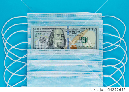 Blue medical masks, and american money, top view 64272652