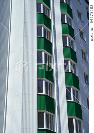 facade of a new multistory building with white and 64275282