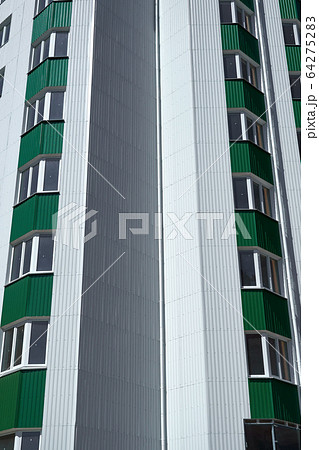 facade of a new multistory building with white and 64275283