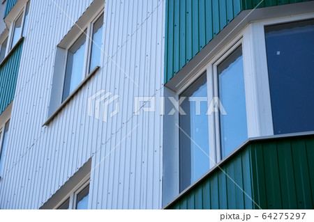 facade of a new multi-storey building with white 64275297