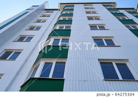 facade of a new multi-storey building with white facade of a new multi-storey building with white 64275304