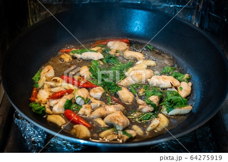 Traditional Thai flavor food.Pad ka prao is a famous food of Thailand people.Spicy sweet basil leaf with garlic chilly and meat stir in the cuisine. 64275919