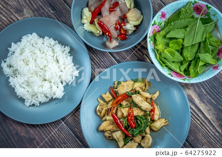 Traditional Thai flavor food.Pad ka prao is a famous food of Thailand people.Spicy sweet basil leaf with garlic chilly and meat stir in the cuisine. Traditional Thai flavor food.Pad ka prao is a famous food of Thailand people.Spicy sweet basil leaf with garlic chilly and meat stir in the cuisine. 64275922