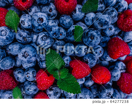 Fresh raspberries and blueberries great bilberry background. Healthy food organic nutrition. Top 64277238