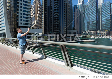 European tourist with an action camera on an 64278308