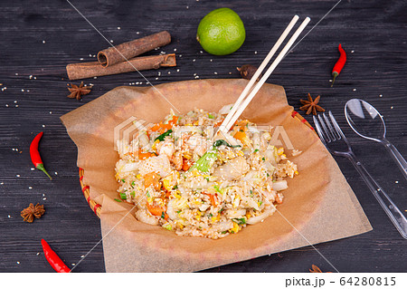 Rice with vegetables, chicken pieces, greens and sesame seeds 64280815