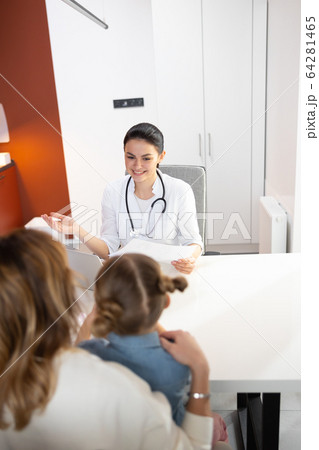 Caucasian beautiful doctor telling about results of clinical research 64281465