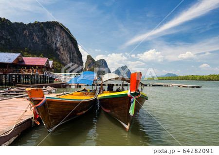 Koh Panyee port with limestone mountain, Phang Nga 64282091