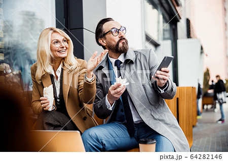 Two adult people gazing into the distance Two adult people gazing into the distance 64282146