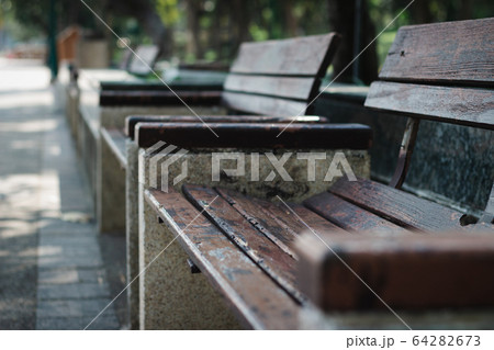 An Empty Bench in the park in the daytime 64282673