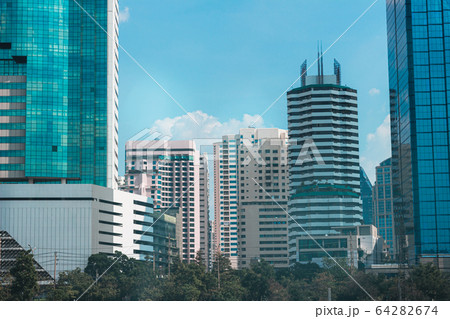 a Lot of Buildings with blue sky near the park 64282674