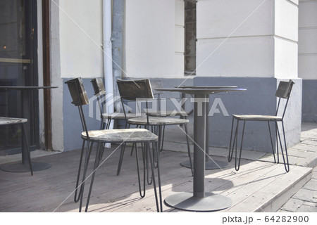 empty street cafe at the daytime in the central 64282900