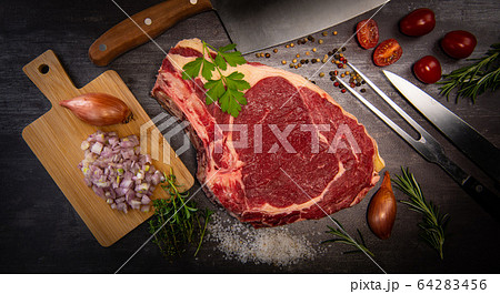 Raw T Bone steak entrecote prepared to Grill on turntable Raw T Bone steak entrecote prepared to Grill on turntable 64283456