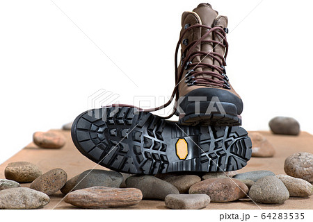 Pair of walking boots in the studio. Pair of walking boots in the studio. 64283535