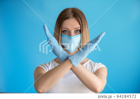 Attractive female nurse showing stop sign with his 64284572