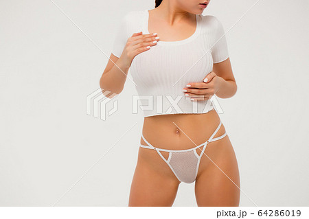Faceless gorgeous woman with hands on thighs Faceless gorgeous woman with hands on thighs 64286019