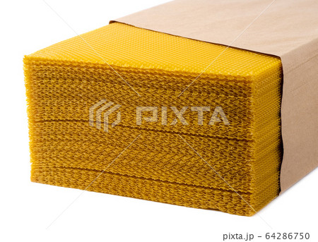 Beeswax. Wax base for honey bee rebuilding on a white background. Honeycombs. 64286750