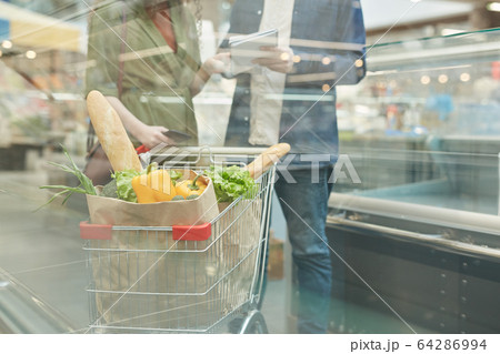Unrecognizable Couple in Grocery Store 64286994