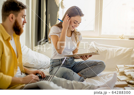 young caucasian couple business people with letters at home young caucasian couple business people with letters at home 64288300