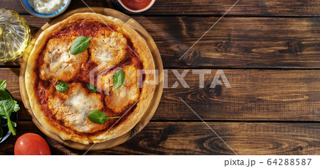 Top view of vegan pizza margherita with 64288587