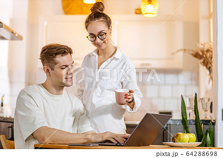 pretty wife support her husband while his working at home pretty wife support her husband while his working at home 64288698