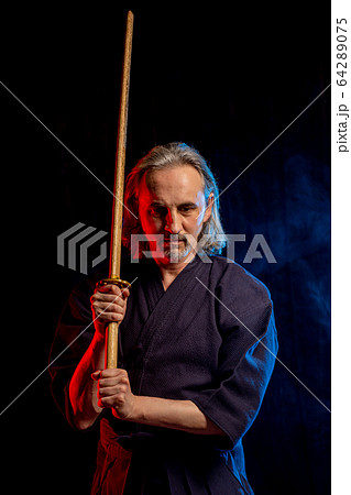 portrait of caucasian man kendo fighter with bokuto 64289075